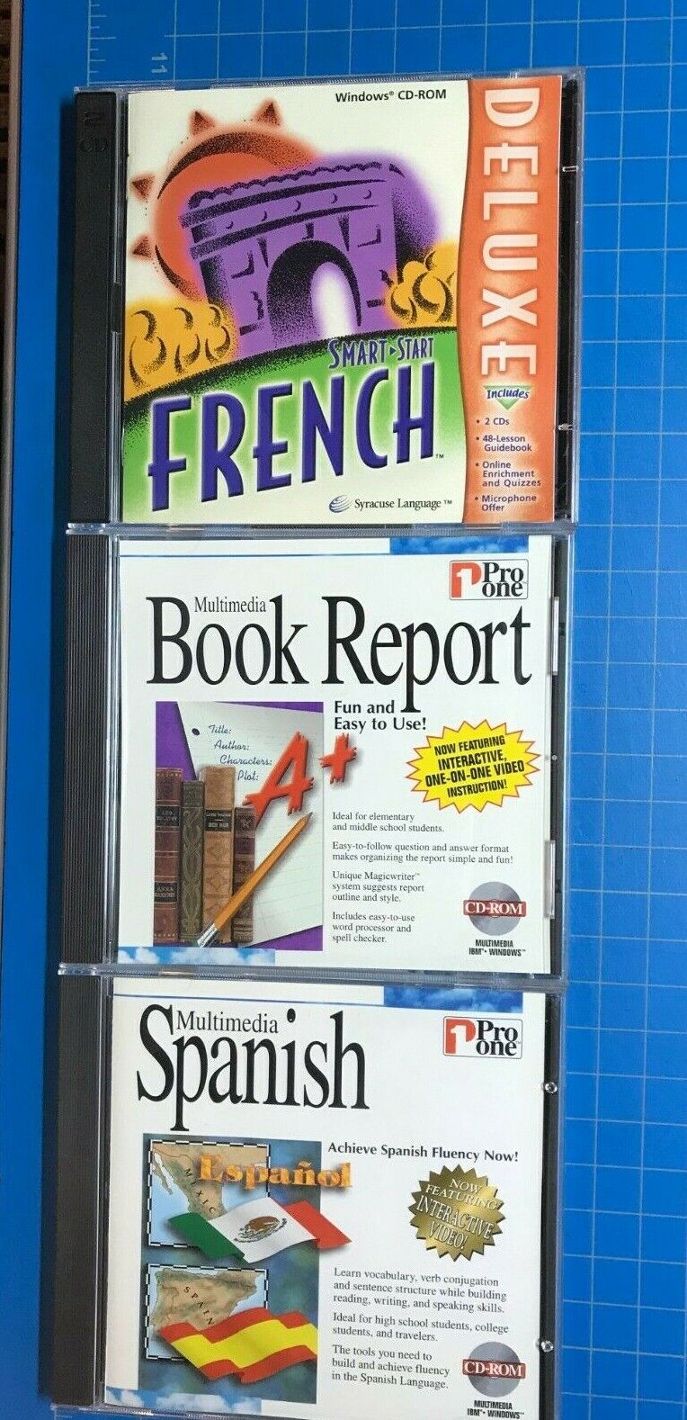 Three (3) Educational CD-ROM Learning Programs French Spanish and Book Report